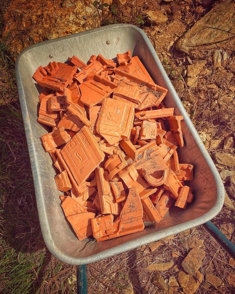 Earth Moving - Wheel barrow full of broken roof tiles