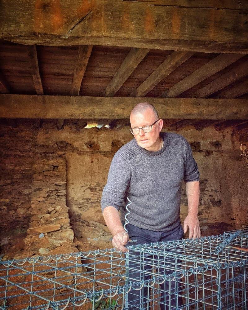 Gary making up the gabions in the adega