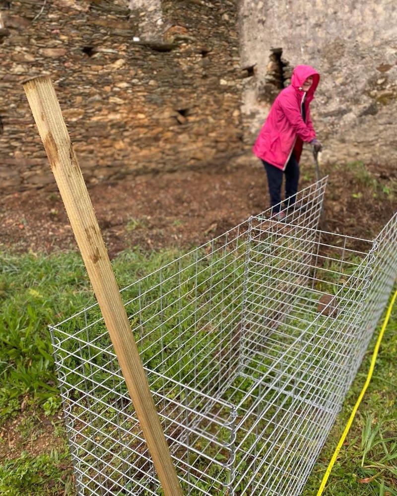 Building gabion walls. Julie digging it!