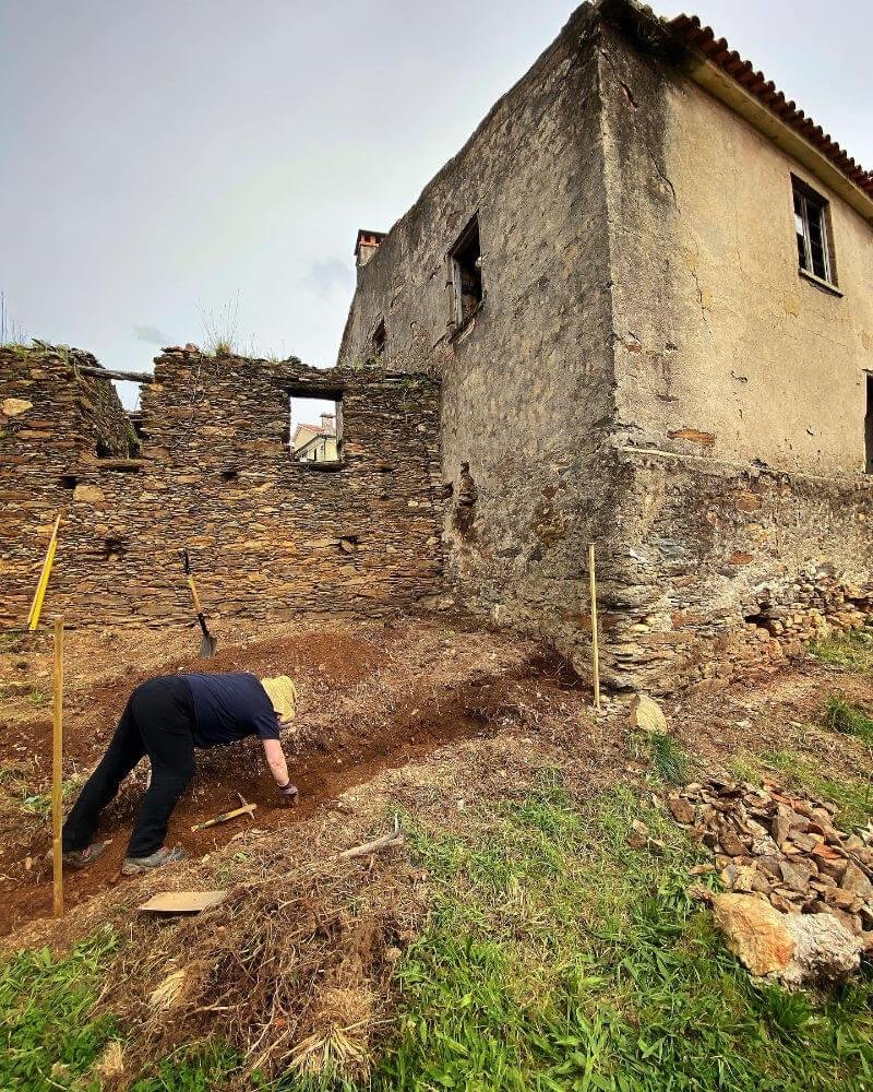 Julie digging the trench for the gabion wall