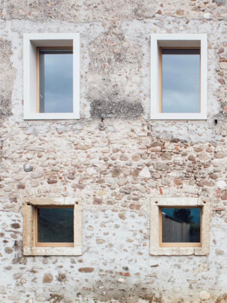 Designboom house renovation showing concrete window surrounds